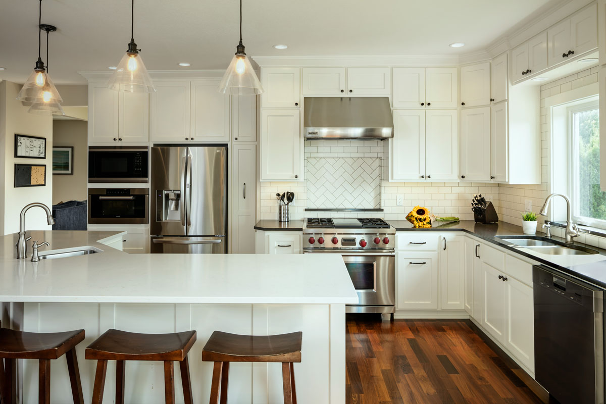 Classic kitchen with white countertops and cabinets